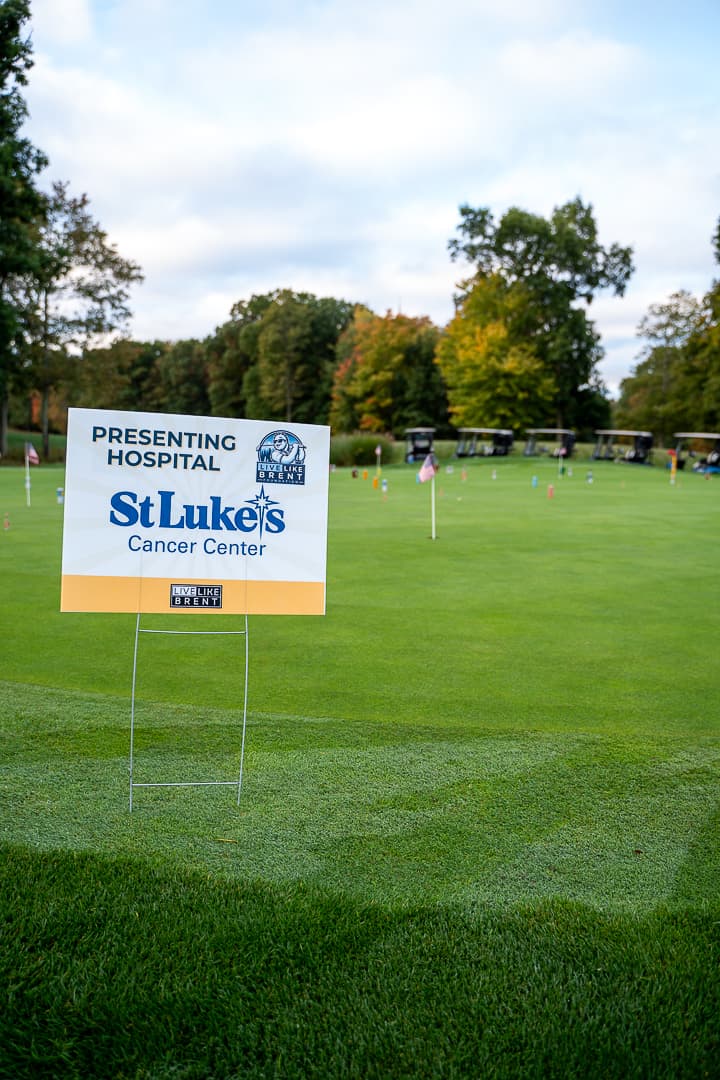 Presenting hospital sponsor signage on the golf course.