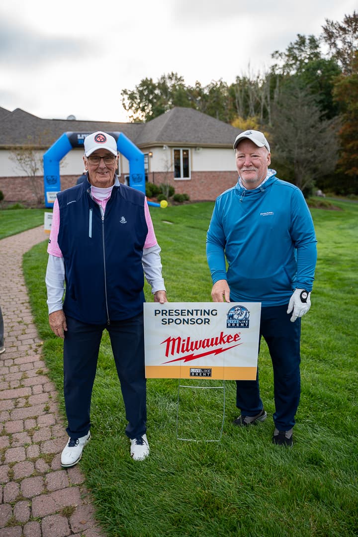 Two golfers posing at the 2026 Live Like Brent Classic.