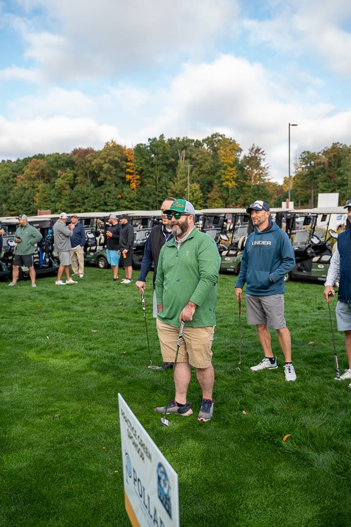 Golfers gathering on the course during the Live Like Brent Classic.