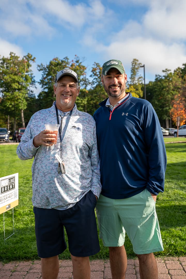 Two Classic participants posing together on the course.